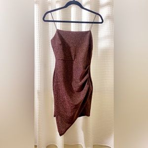 Size medium. Sparkly purple/silver dress. Perfectly tight. Hardly worn.